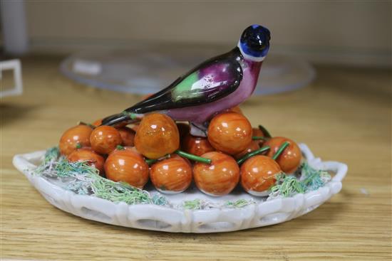 A Meissen cup, a jug, a bust, and a bird dish